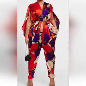 Vibrant Red and Blue Caped Jumpsuit with Abstract Print
